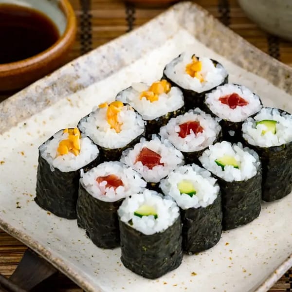 A plate of Sushi Hiro's maki sushi rolls with tuna, cucumber, and yellow pickled radish.