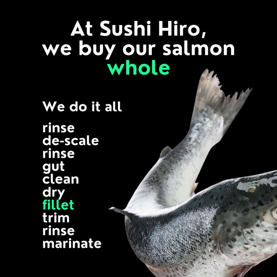 Two whole salmon on a black background with text detailing Sushi Hiro's salmon preparation process.